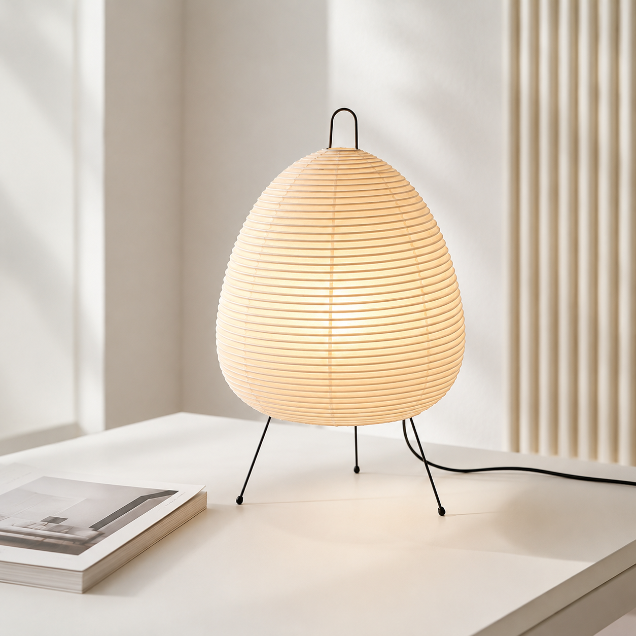 Kumo paper shade table lamp in a bedroom interior
