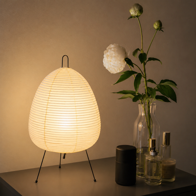 White paper shade and slim metal frame of the Kumo lamp