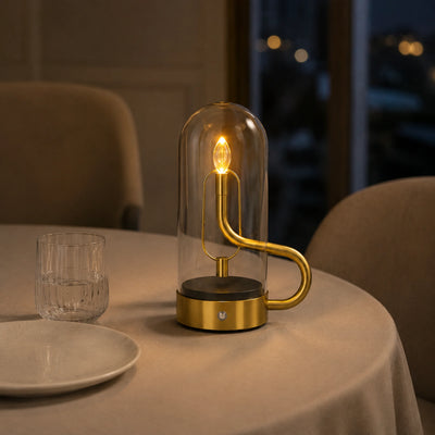 Ember Dome J006 lamp with a warm flame-style LED inside a clear glass cylinder.