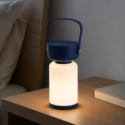 Glow Flask lamp hanging inside a covered tent setup.