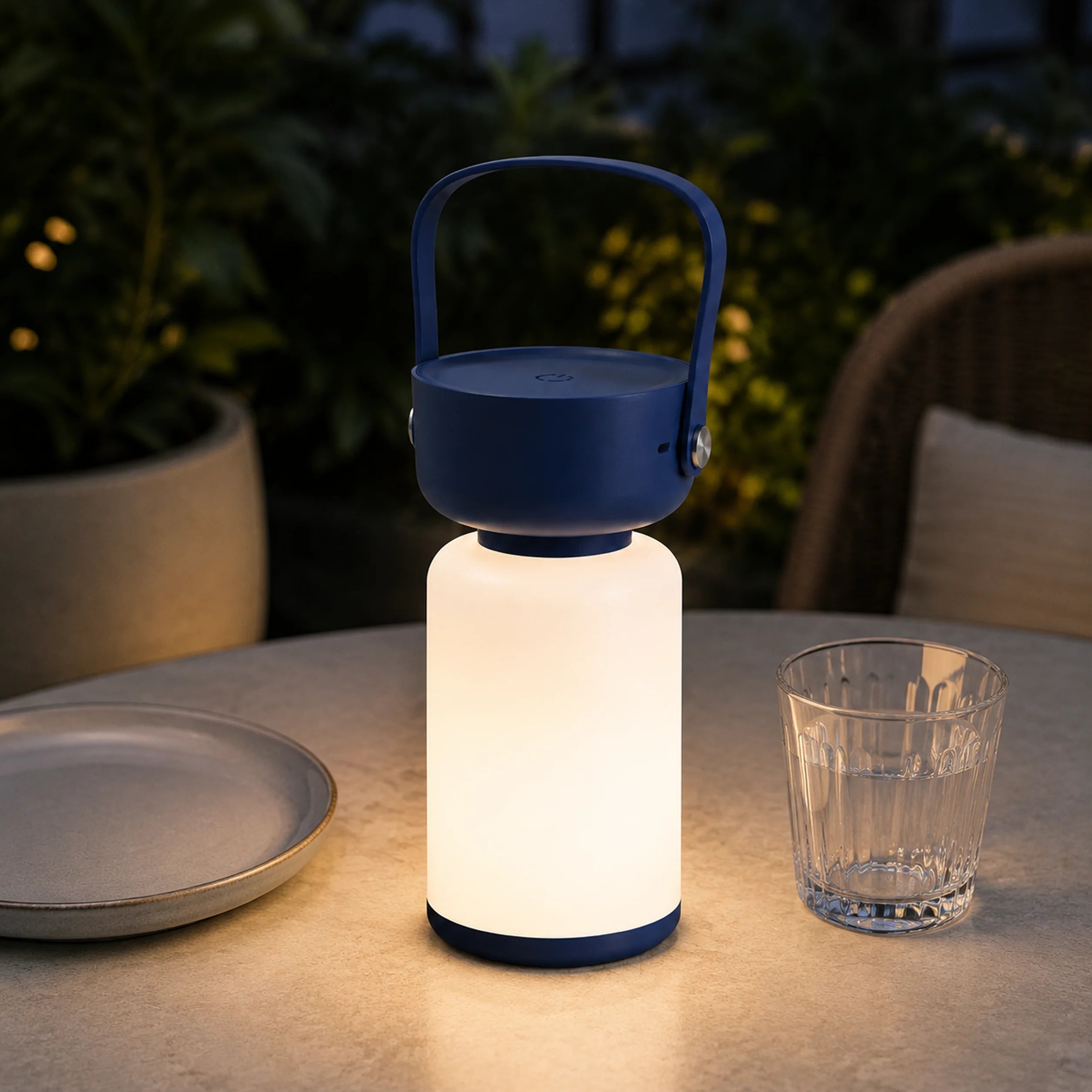 Glow Flask LS-8962 bottle-shaped rechargeable lamp glowing on a table.