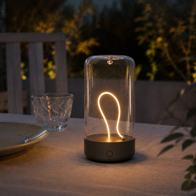Pocket Halo QY-PR062 compact magnetic table lamp glowing on a tabletop.