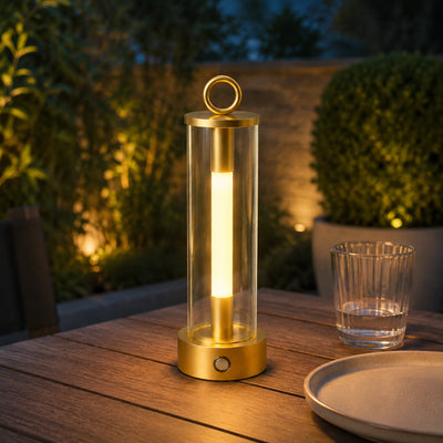 Nomad Glow cordless metal table lamp with a slim stem and round base.