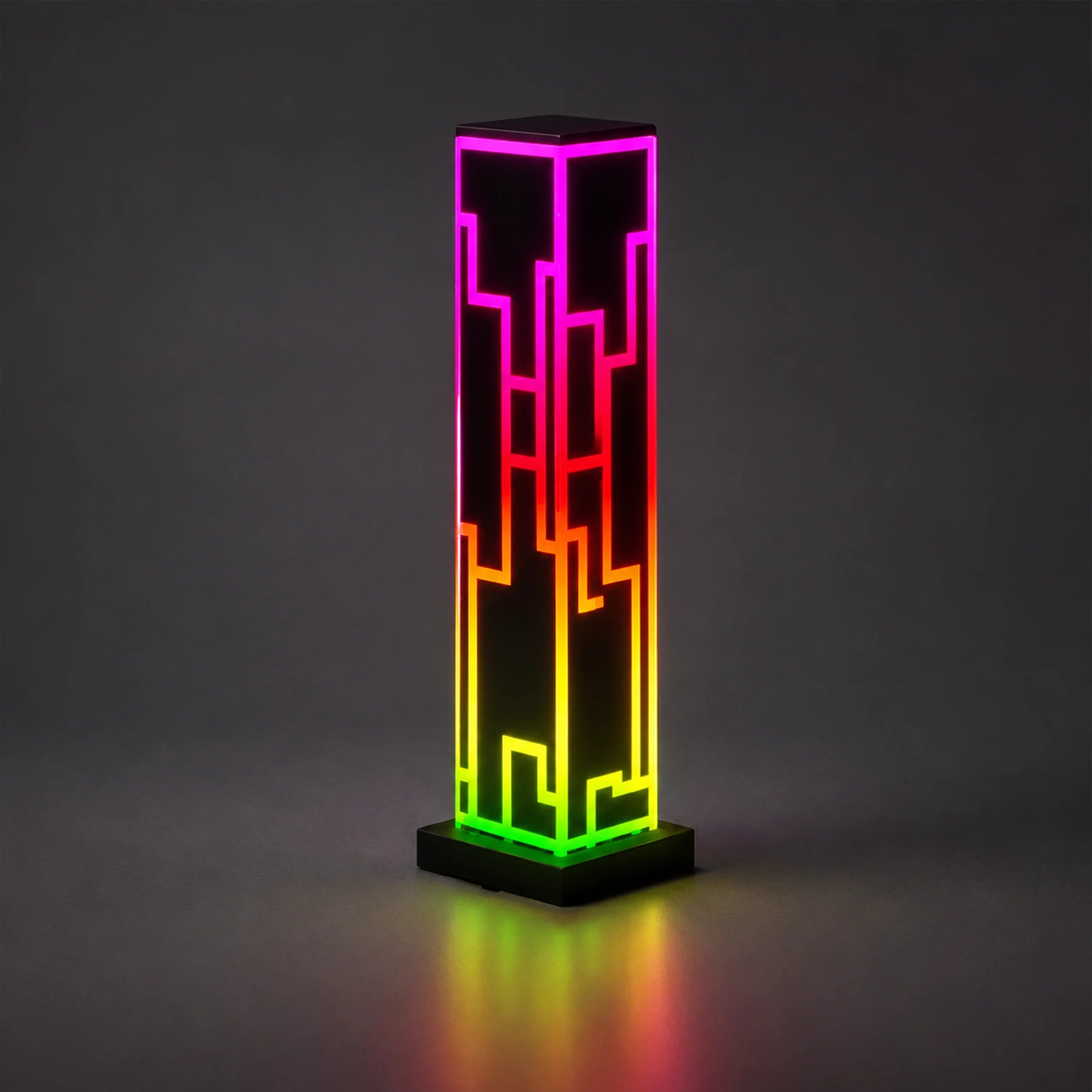 Remote control shown beside the multicolor cube lamp.