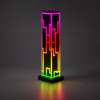 Remote control shown beside the multicolor cube lamp.
