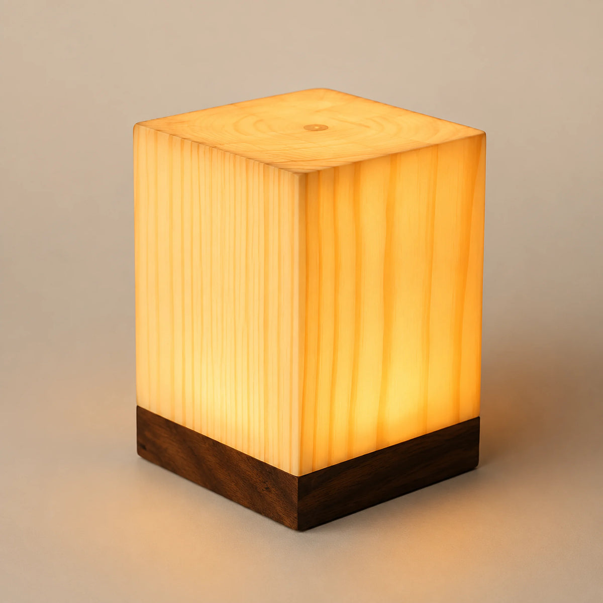 JSB-02 night light in warm white mode on a bedside table.